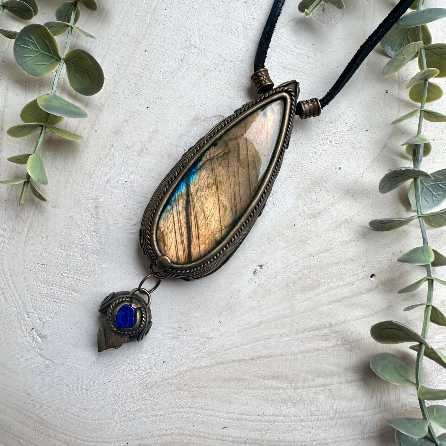Bold statement pendant necklace featuring a large gold labradorite
