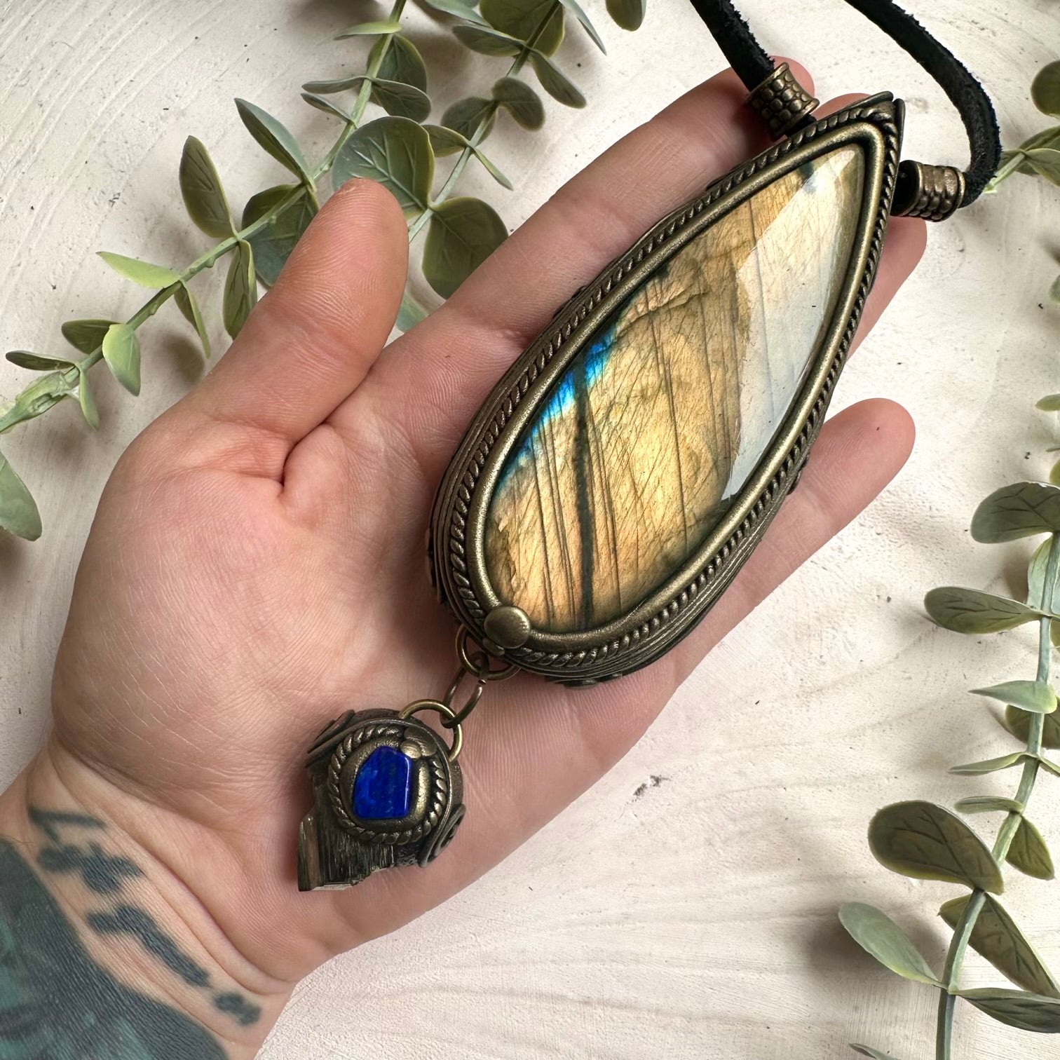 Handmade statement necklace featuring gold labradorite pyrite and lapis lazuli