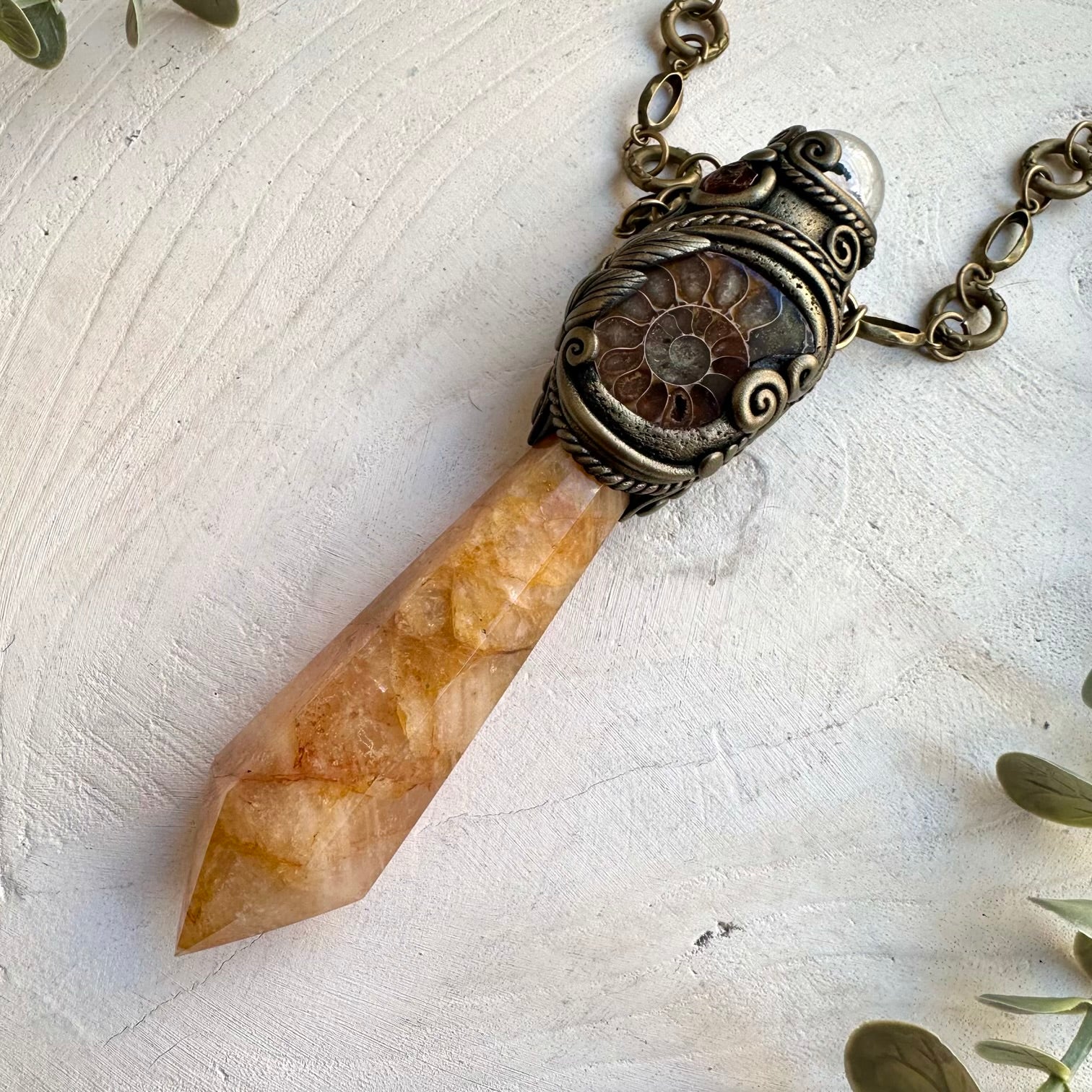 Handmade golden healer crystal wand with ammonite and garnet