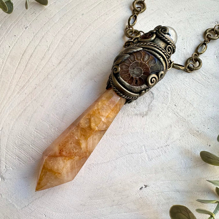 Handmade golden healer crystal wand with ammonite and garnet