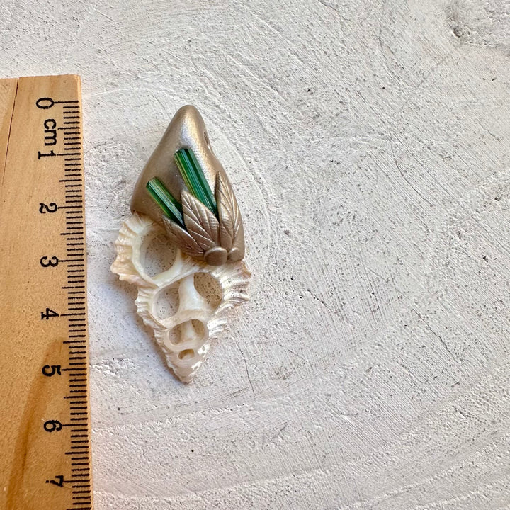 Spiritual necklace featuring green tourmaline and seashell slice