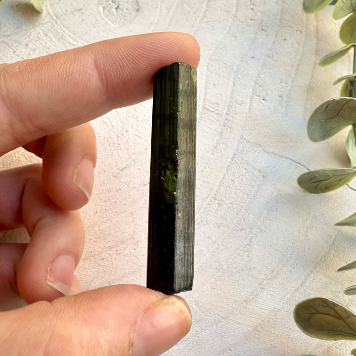 Raw green tourmaline crystal for collectors