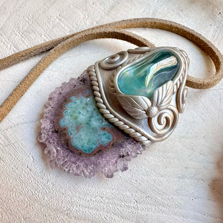 Spiritual pendant featuring aqua aura quartz and amethyst