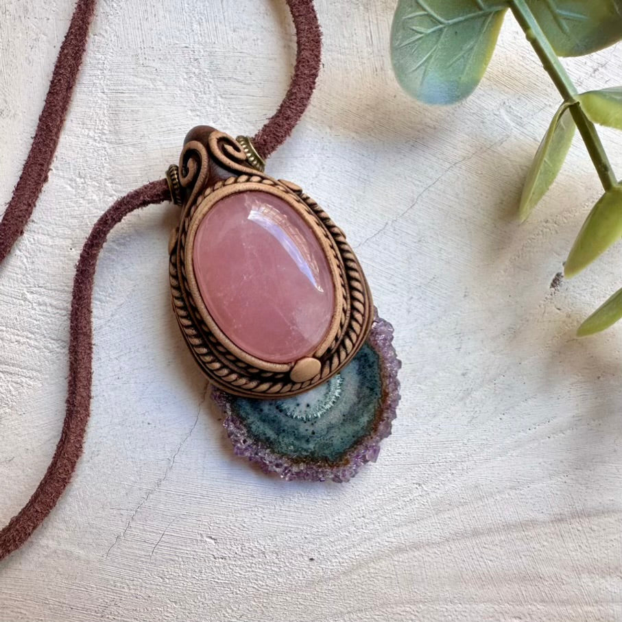 Natural amethyst stalactite paired with rose quartz in a pendant