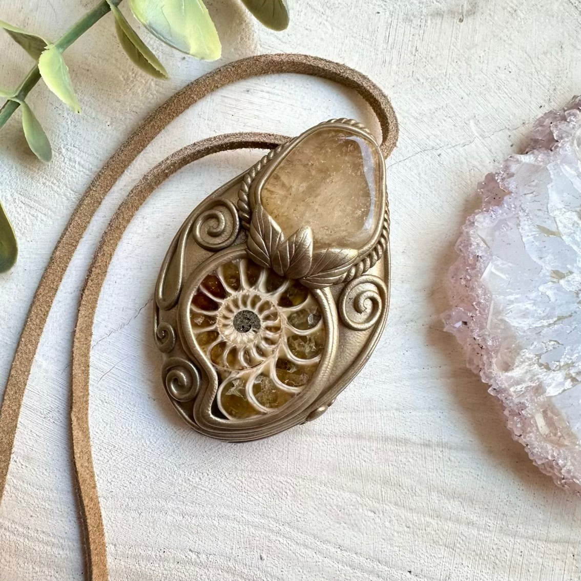 Handmade necklace featuring ammonite fossil and citrine