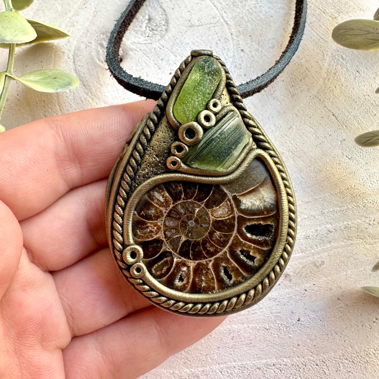 Handmade crystal jewelry with natural Ammonite, Peridot and green Moldavite gemstones.