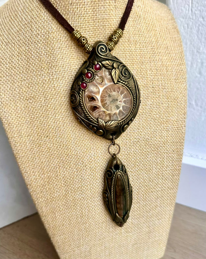 Handmade crystal necklace with a fossil Ammonite and colorful natural gemstone accents.