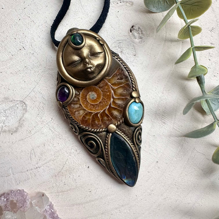 Ammonite fossil paired with labradorite larimar and black opal goddess