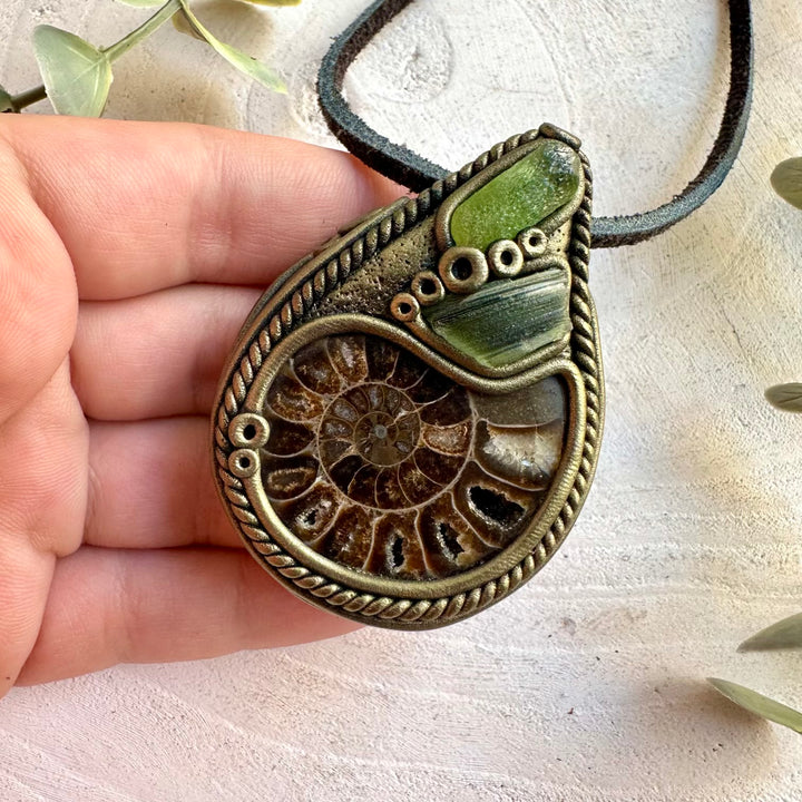 One of a kind pendant with a natural Ammonite fossil, bright green Peridot and Moldavite.