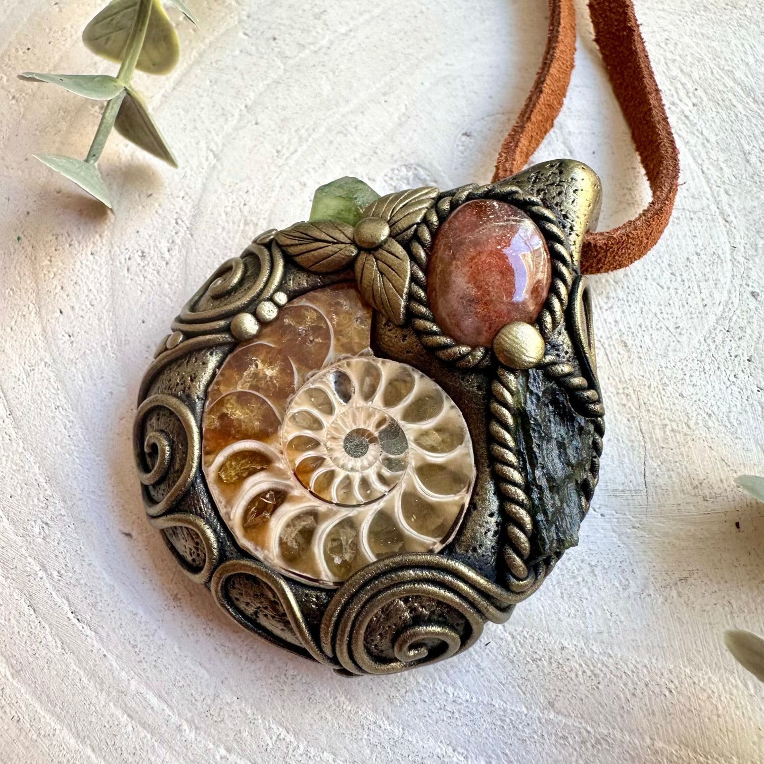 Unique unisex jewelry featuring Ammonite with warm Sunstone, bright Peridot and natural Moldavite.