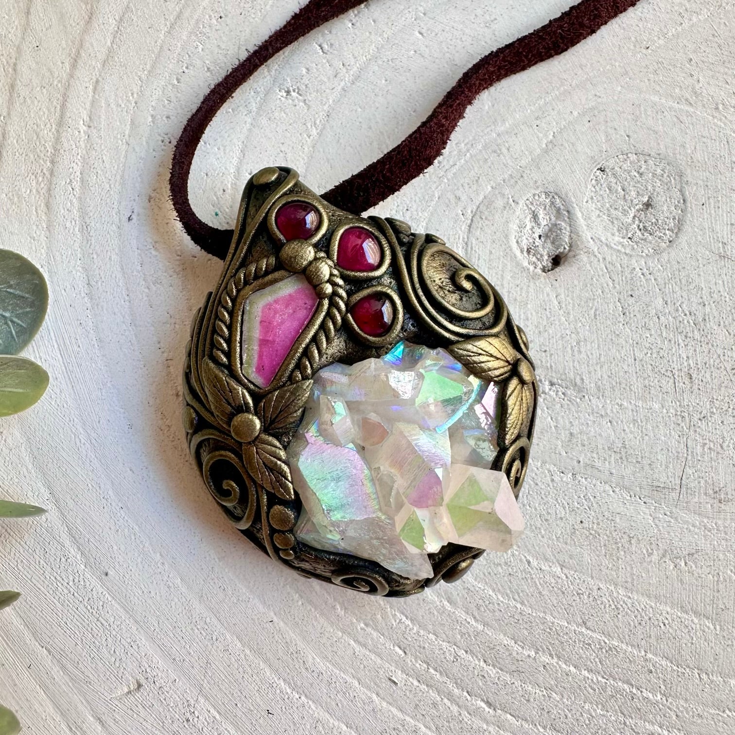 Unique crystal necklace combining an iridescent Angel Aura Quartz Cluster with pink and green Tourmaline.