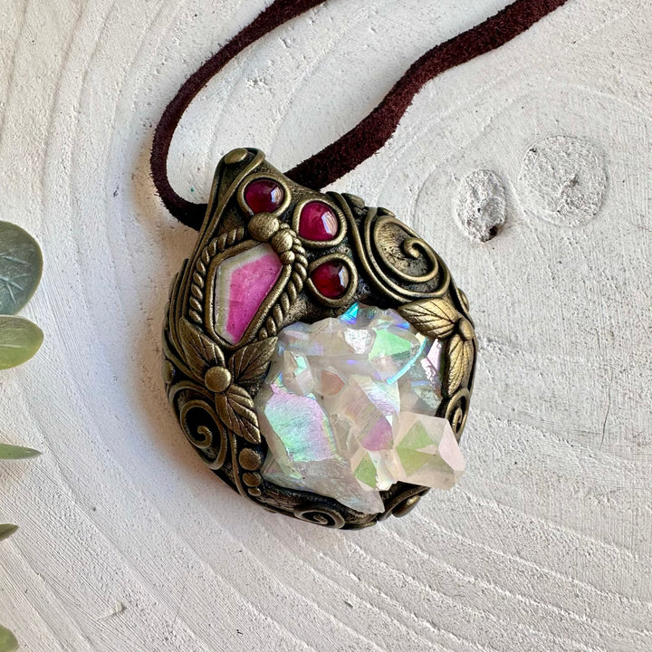 Unique crystal necklace combining an iridescent Angel Aura Quartz Cluster with pink and green Tourmaline.