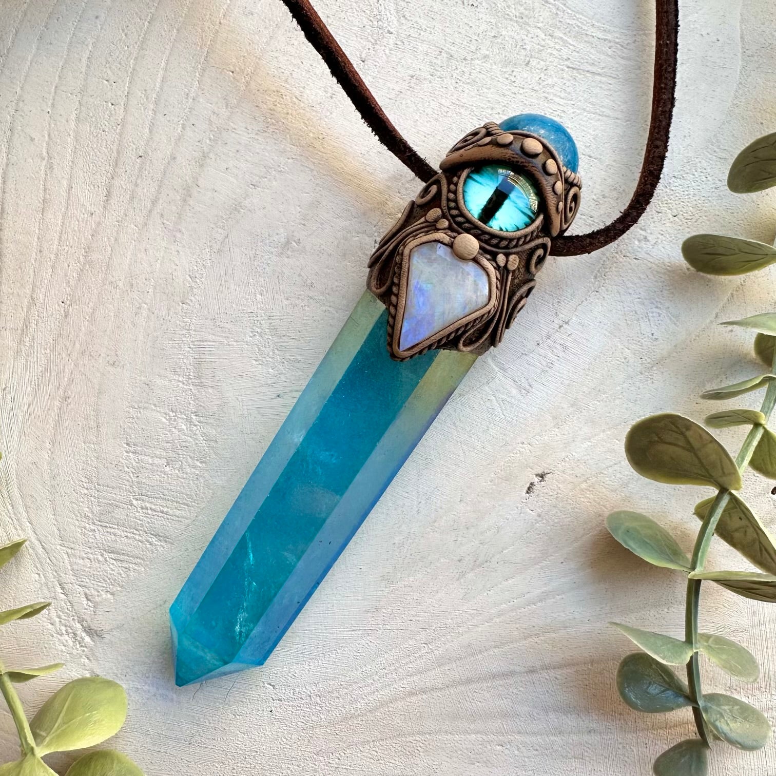 Handmade spiritual necklace featuring aqua aura quartz and blue apatite