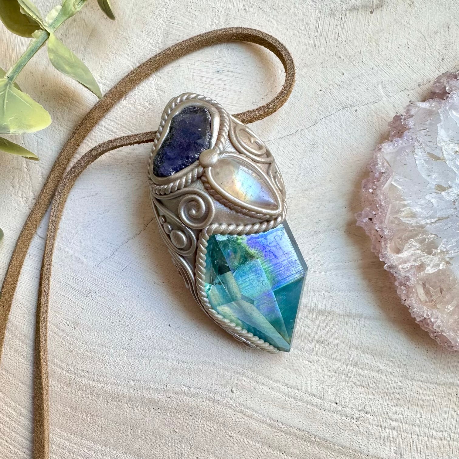 Spiritual pendant featuring aqua aura quartz and raw tanzanite