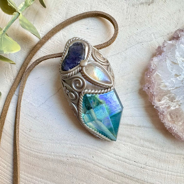 Spiritual pendant featuring aqua aura quartz and raw tanzanite