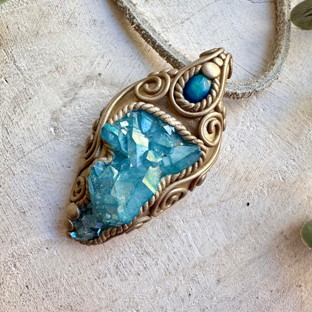 One of a kind healing crystal jewelry piece combining the luminous, iridescent beauty of Aqua Aura Quartz with the captivating blue flashes of Ethiopian Opal.