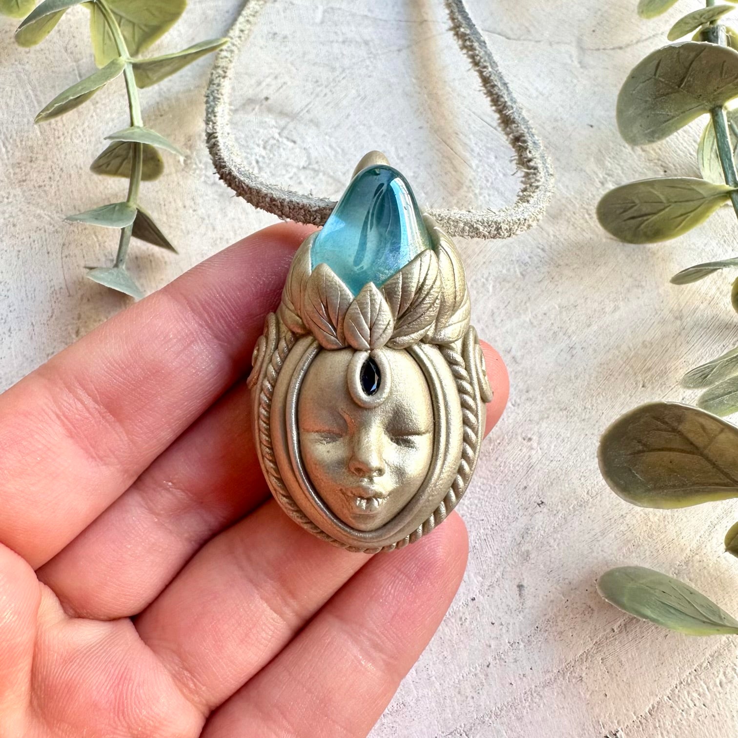 Unique Goddess jewelry featuring iridescent Aqua Aura Quartz and rich blue Sapphire.