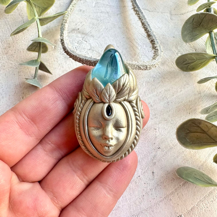 Unique Goddess jewelry featuring iridescent Aqua Aura Quartz and rich blue Sapphire.