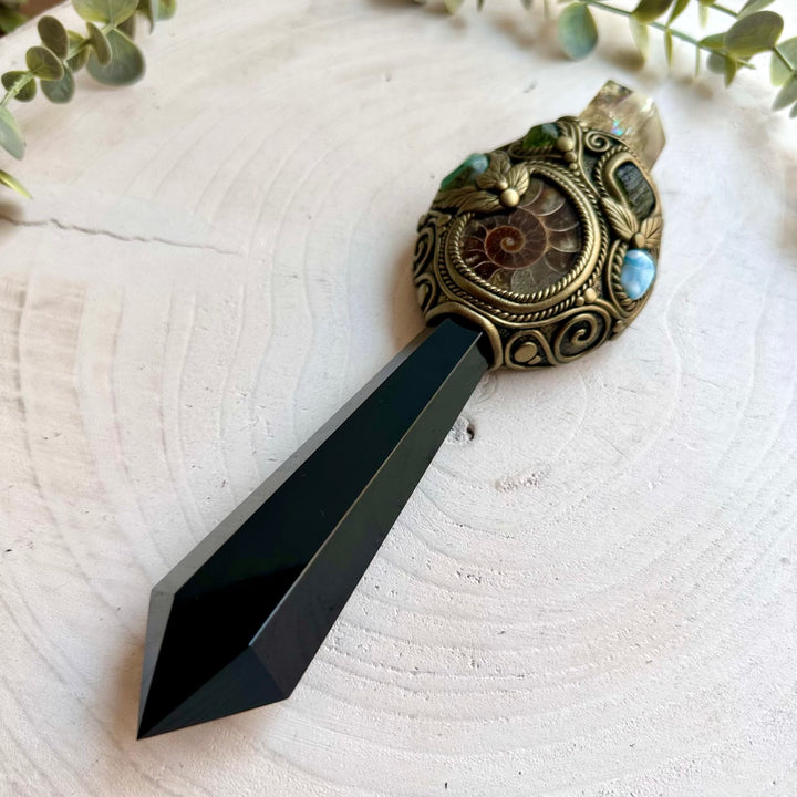Ritual energy wand combining Ammonite, Emerald, Peridot and Larimar natural crystals.