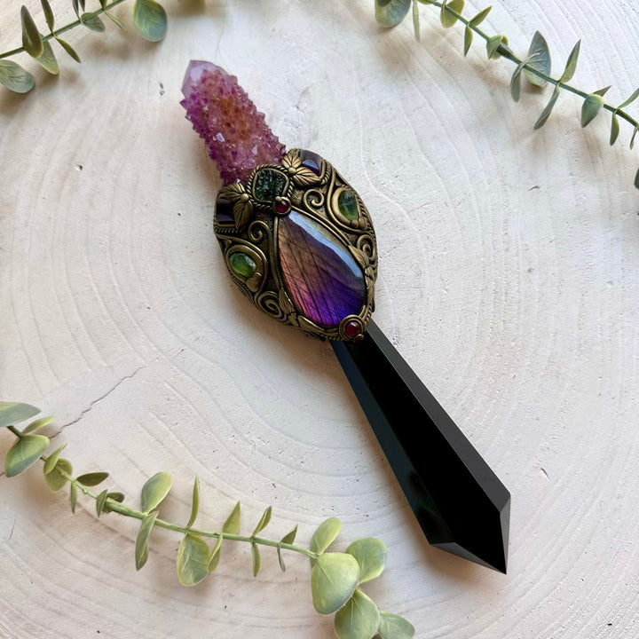 Ritual energy wand combining Labradorite, Amethyst, Peridot and Rhodolite Garnet in a handcrafted design.
