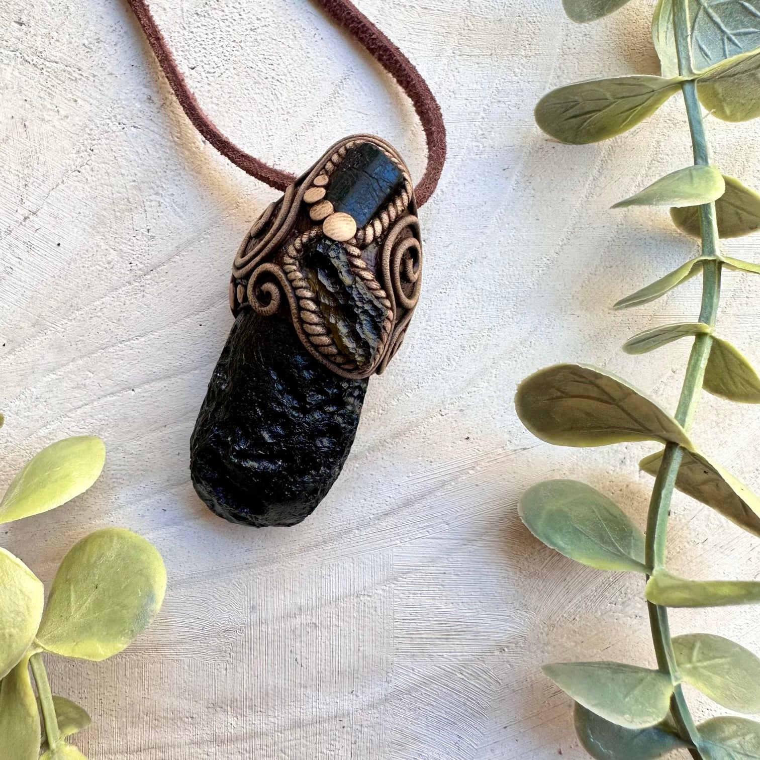 Spiritual protection pendant featuring black tourmaline and moldavite