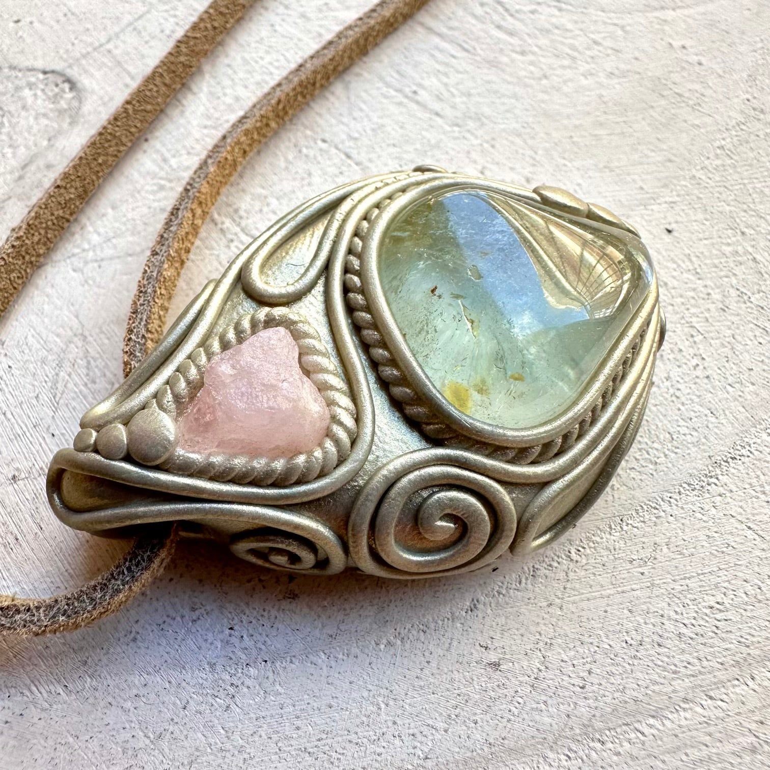 Morganite paired with blue topaz in a pendant necklace
