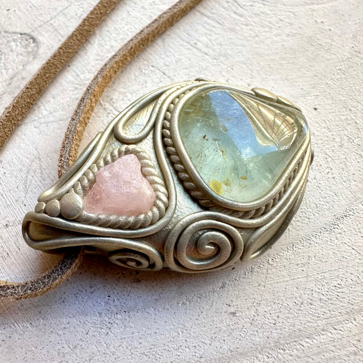 Morganite paired with blue topaz in a pendant necklace
