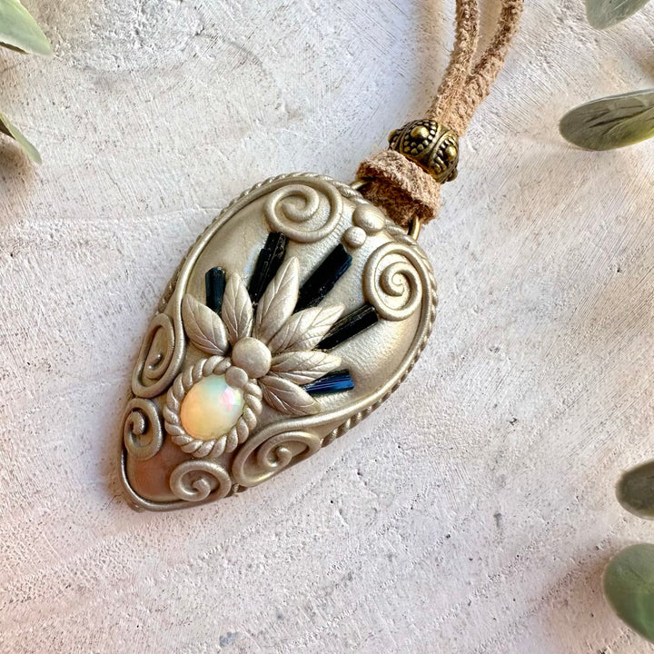 Handmade Blue Tourmaline and Ethiopian Opal pendant necklace, a one of a kind gemstone jewelry piece combining rich blue Tourmaline with the mesmerizing natural flashes of Ethiopian Opal.