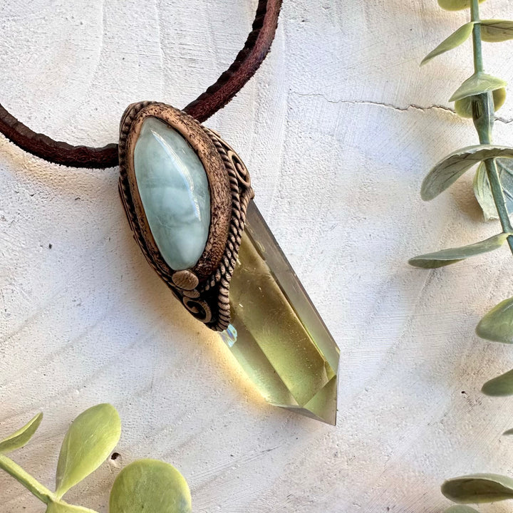 Spiritual pendant featuring citrine and aquamarine gemstones
