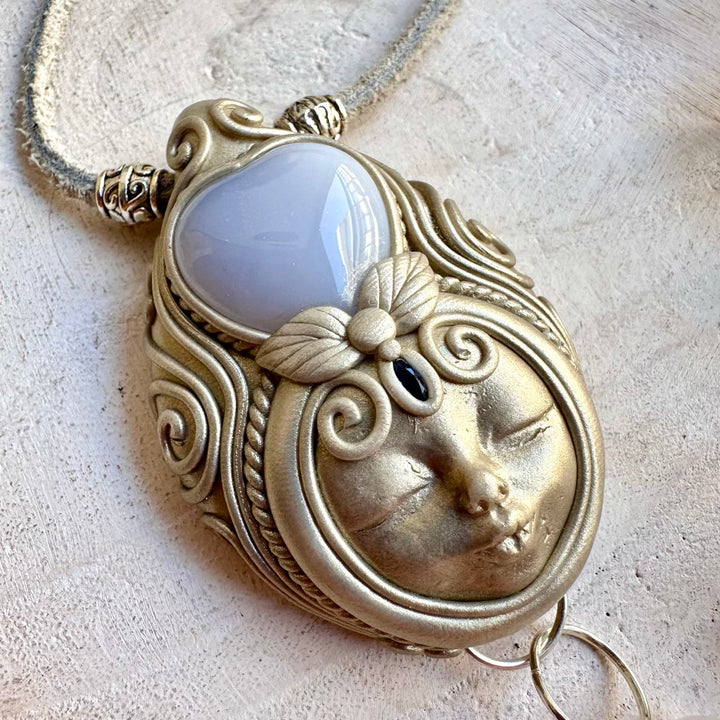 Natural gemstone pendant with a Blue Chalcedony Heart, sparkling Clear Quartz and deep blue Sapphire.