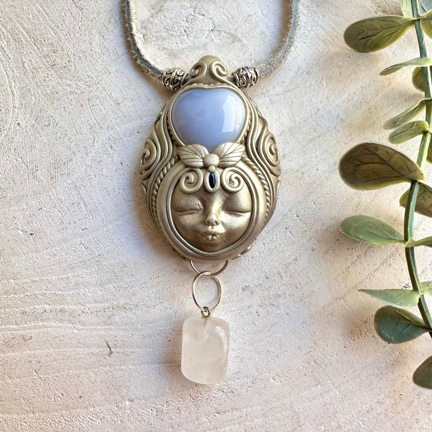 Unique Goddess jewelry featuring a heart-shaped Blue Chalcedony with Clear Quartz and Sapphire accents.