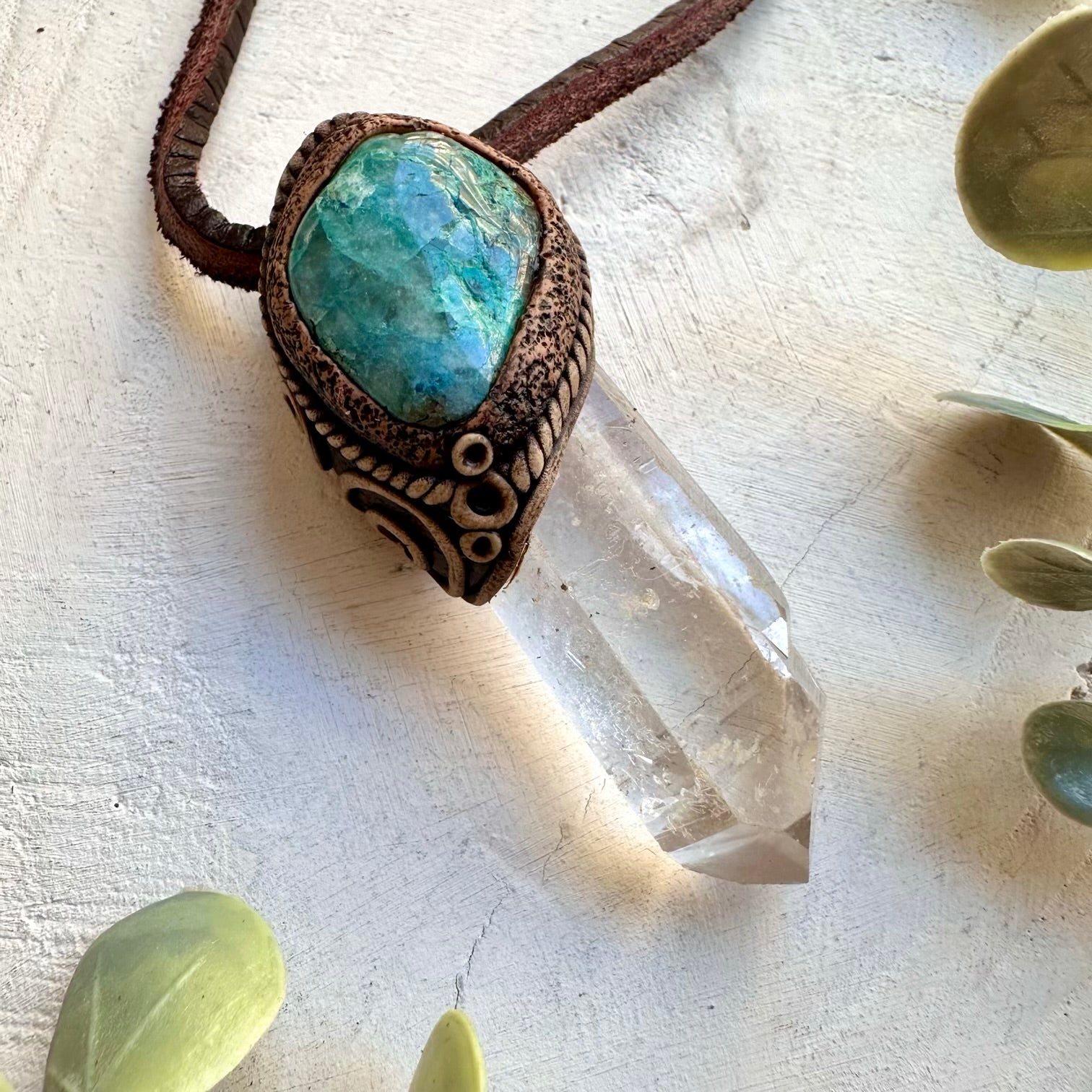 Spiritual pendant featuring a long clear quartz crystal point