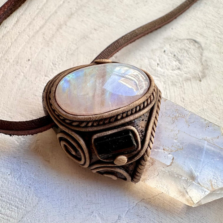 Spiritual pendant featuring a large clear quartz crystal point