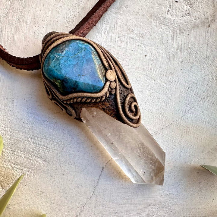 Spiritual pendant featuring a clear quartz crystal point