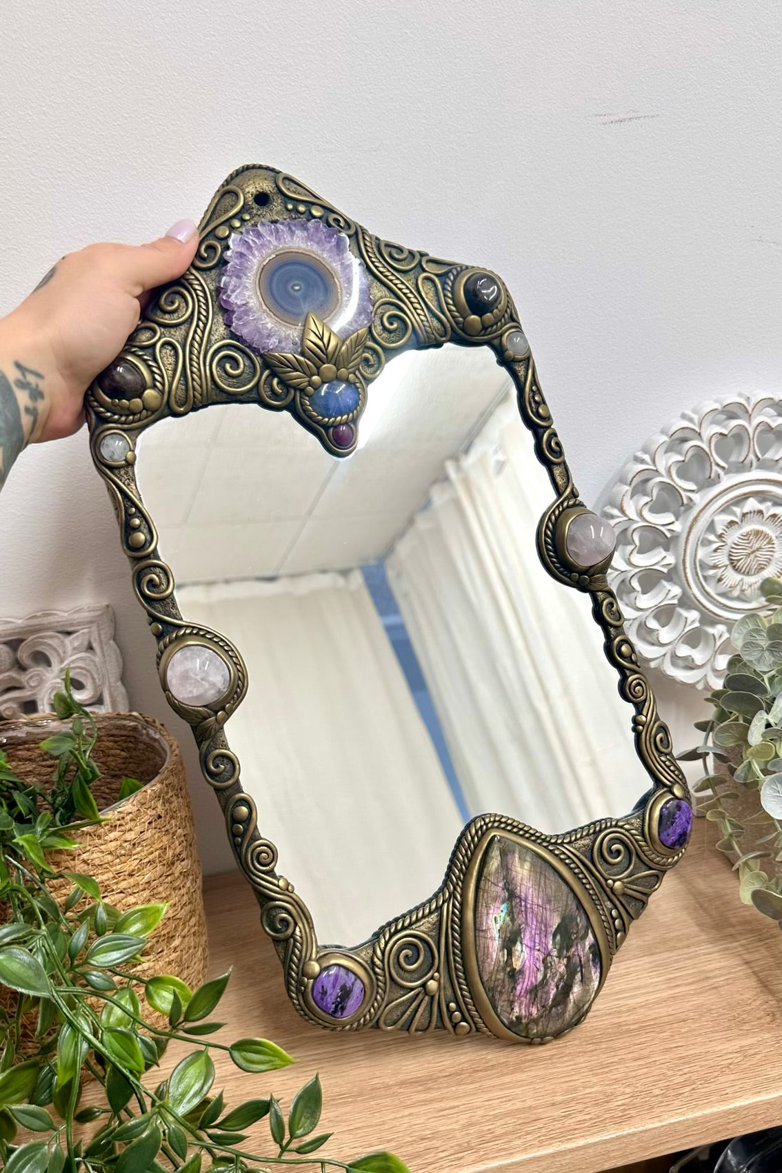 Large crystal wall mirror decorated with Amethyst Stalactite, Rose Quartz, Charoite, Ruby and Red Garnet.