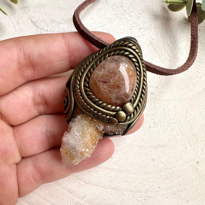 Crystal pendant necklace with Spirit Quartz and Hematite Quartz designed for meditation and metaphysical practices.