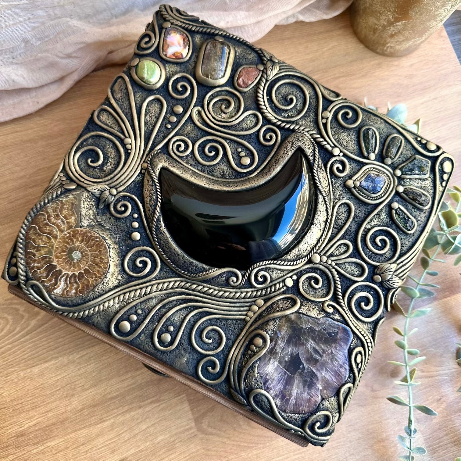 Handmade wooden box decorated with crystals including Black Obsidian Moon and Moldavite