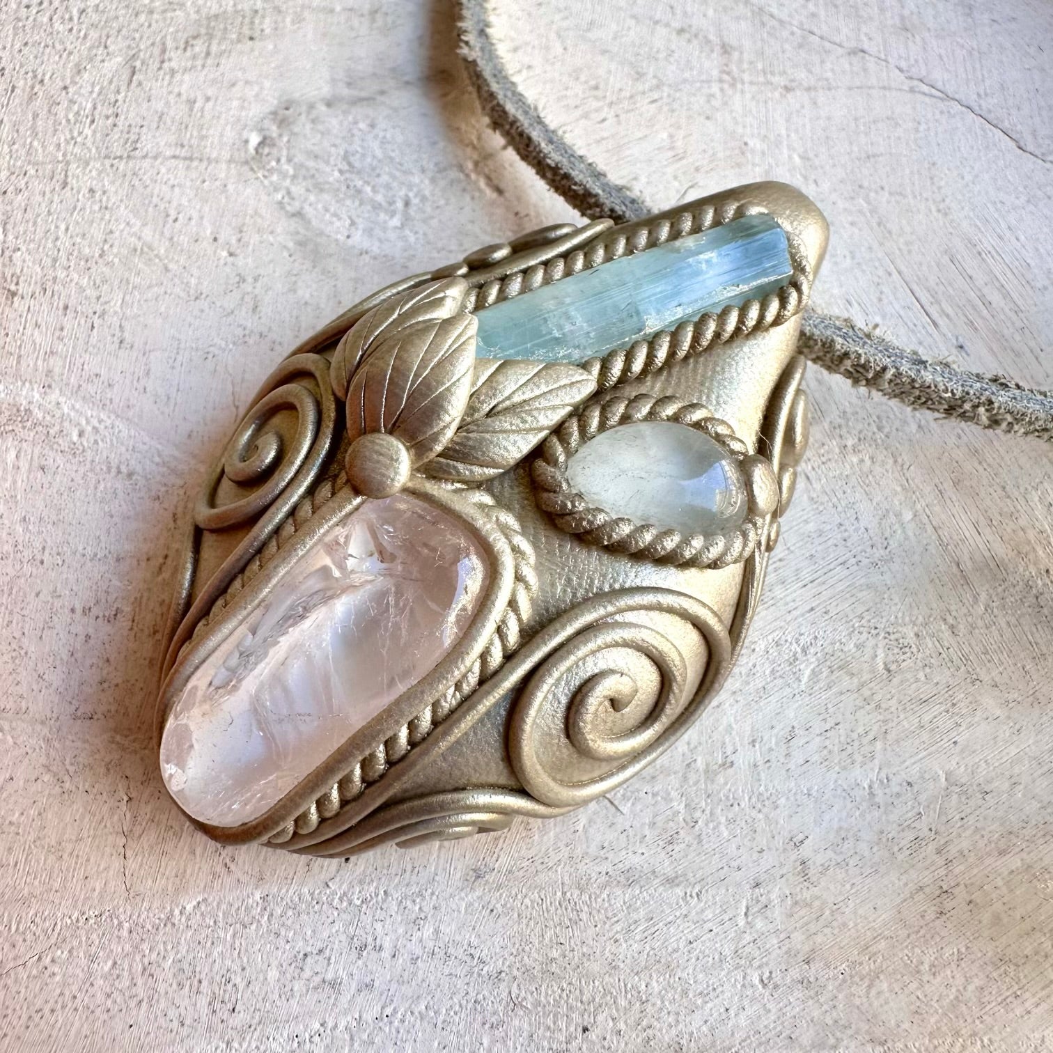 Handmade healing crystal necklace featuring Aquamarine, Danburite and Clear Topaz.