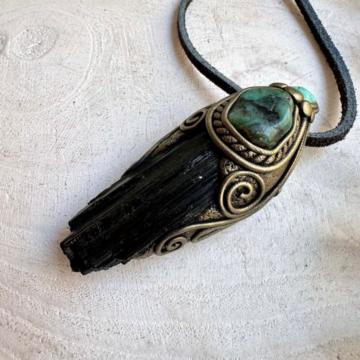 Handmade healing crystal jewelry featuring Black Tourmaline, Emerald and Tibetan Turquoise.