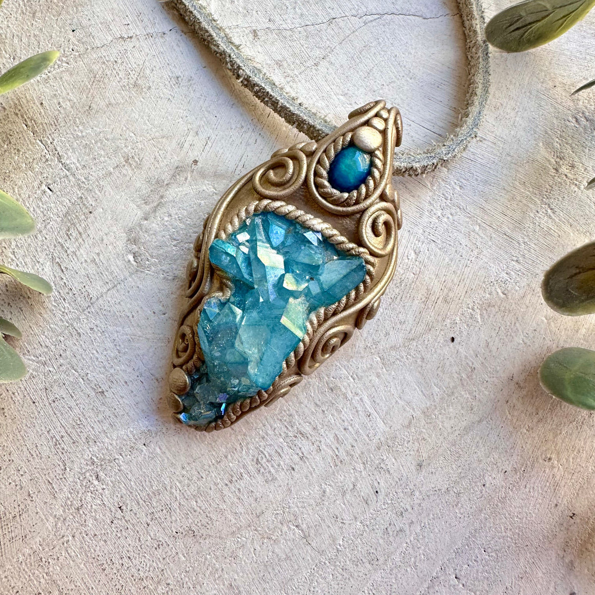 Handmade healing crystal necklace featuring Aqua Aura Quartz and natural Blue Ethiopian Opal.