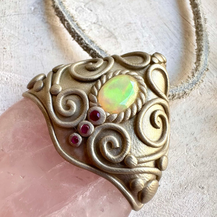 Unique gemstone pendant featuring Rose Quartz with iridescent Ethiopian Opal and rich red Ruby.