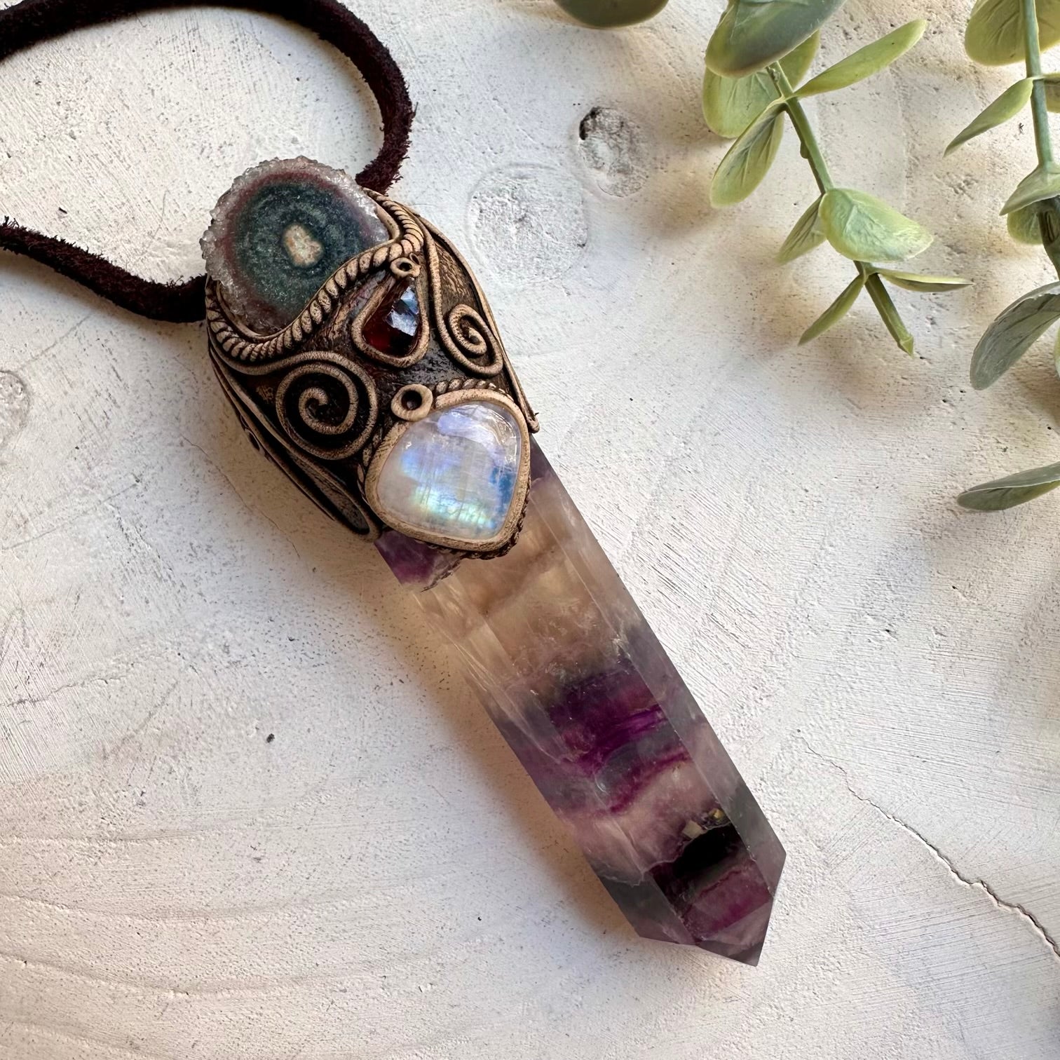 Rainbow fluorite paired with amethyst stalactite and garnet