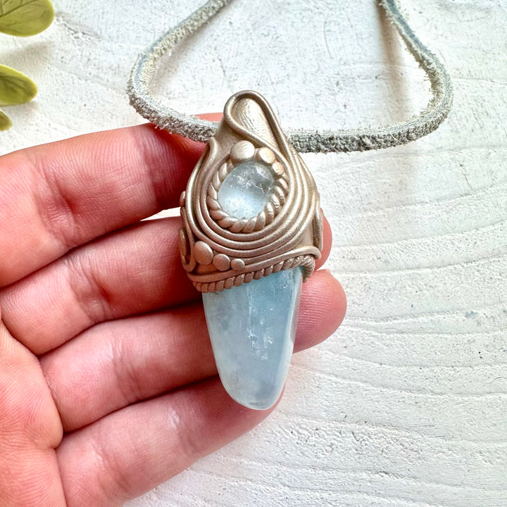 Metaphysical crystal jewelry handmade with aquamarine and blue topaz healing crystals