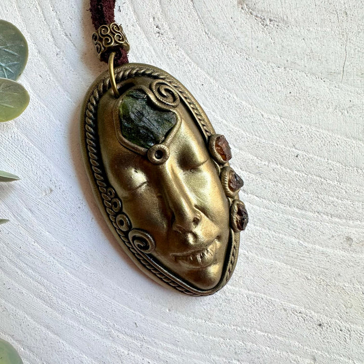 Unique Goddess jewelry featuring green Moldavite and deep orange Hessonite Garnet.