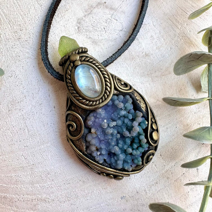 Handmade healing crystal necklace featuring Grape Chalcedony, Rainbow Moonstone and Peridot.