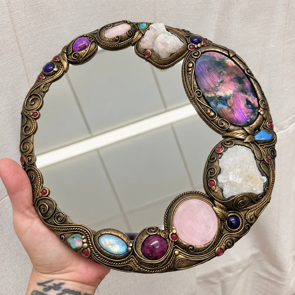 Unique healing crystal mirror decorated with Purple Labradorite, Amethyst and Angel Aura Quartz for altar decor.