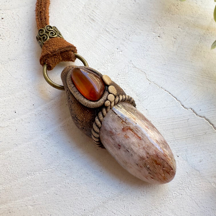Metaphysical jewelry featuring Hematite Quartz and Amber