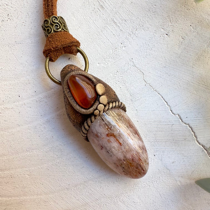 Amber pendant necklace with natural Hematite Quartz crystal