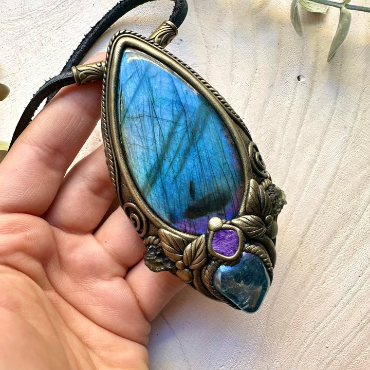 Natural large labradorite paired with moldavite and charoite