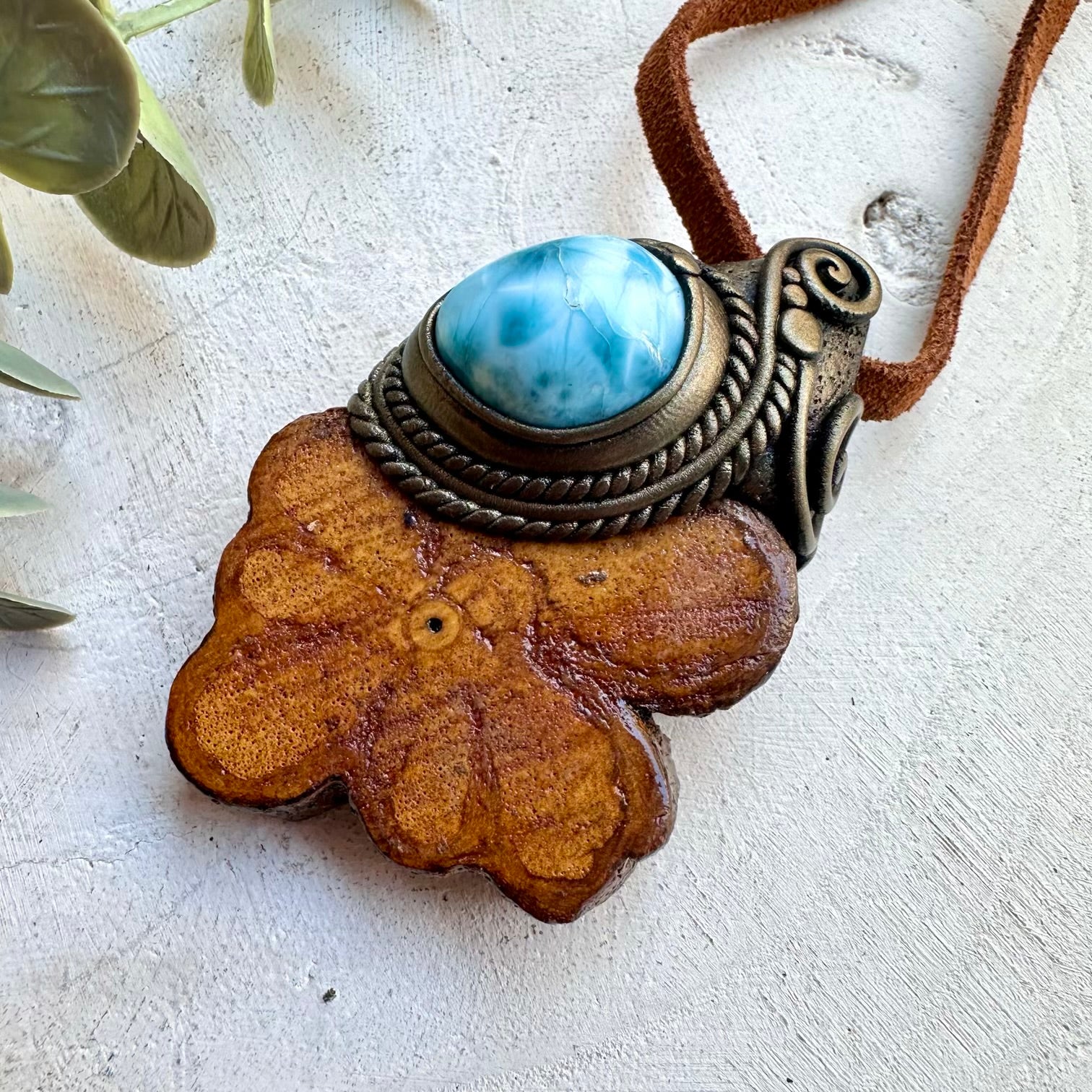 Larimar paired with ayahuasca vine in a necklace